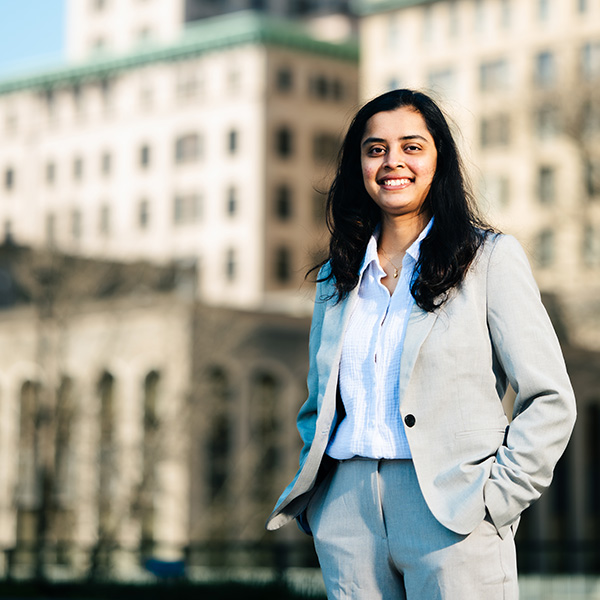 Business student standing in front of a building in downtown Hartford Connecticut